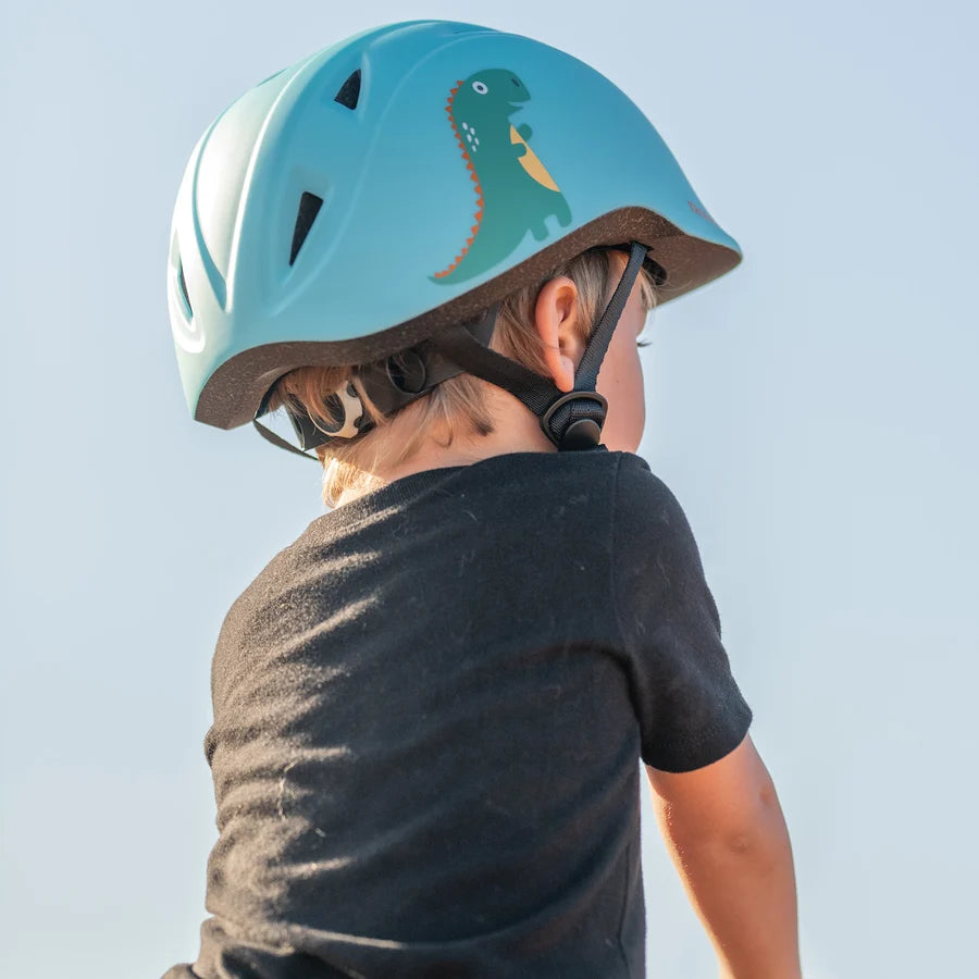 Niño de perfil con casco Troxel Youngster verde azulado